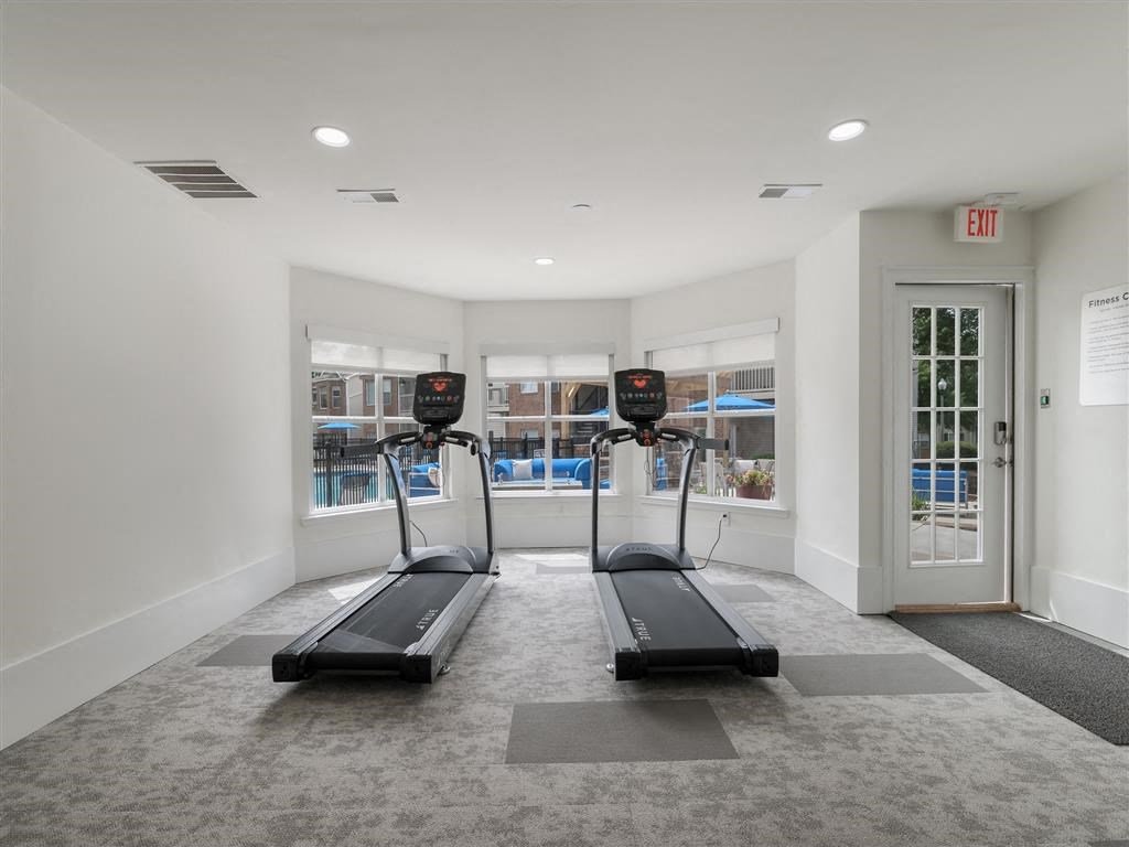 24-hour premium fitness center with exercise machines, soft flooring, and high ceiling at Chace Lake Villas apartments in Birmingham, AL 24-hour premium fitness center with exercise machines, soft flooring, and high ceiling at Chace Lake Villas apartments in Birmingham, AL